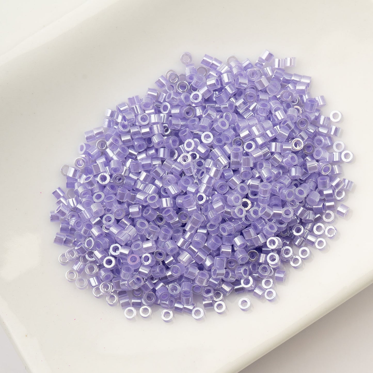 CYLIN BEAD 11/0 25G BAG CRYSTAL PURPLE LINED CEYLON
