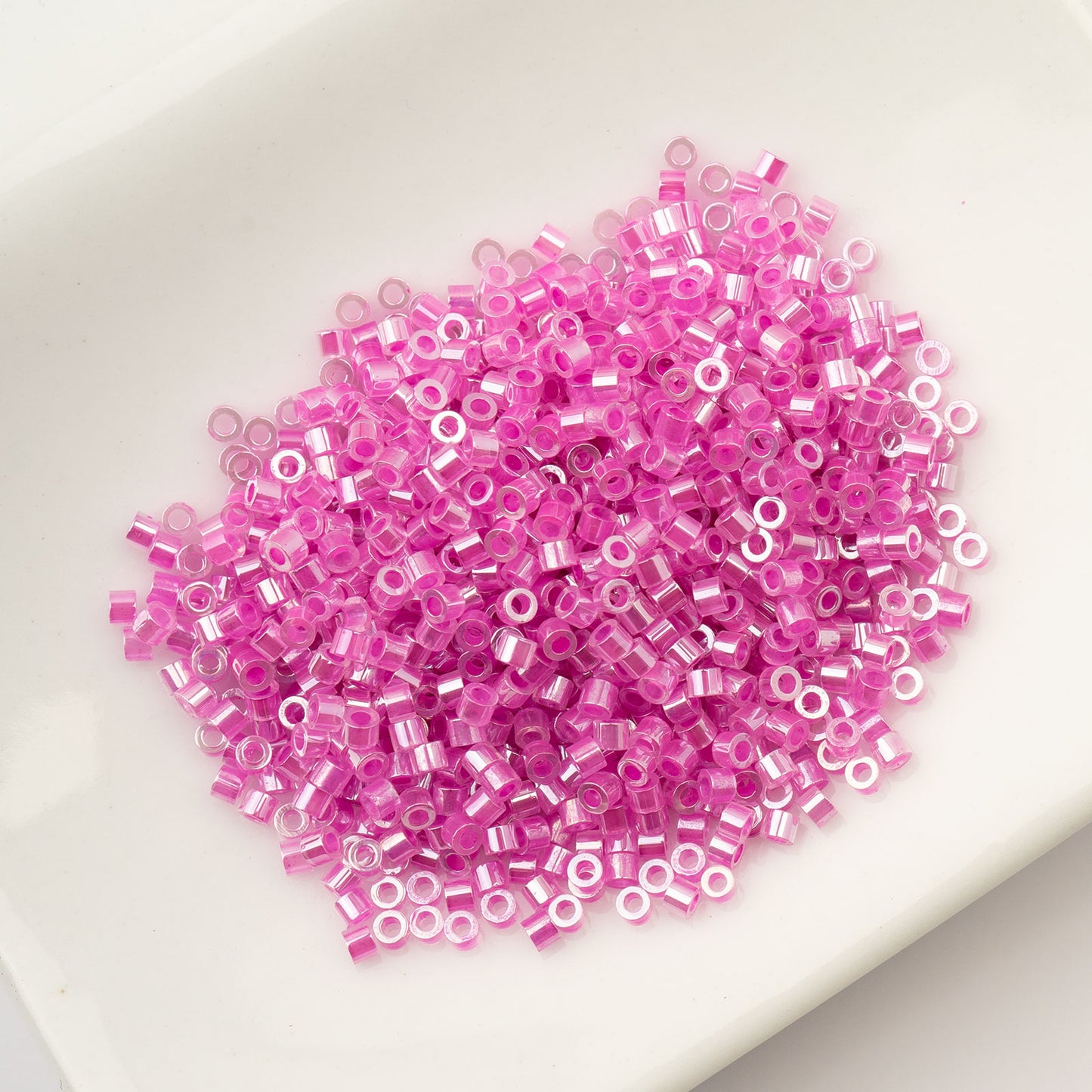 CYLIN BEAD 11/0 25G BAG CRYSTAL FUCHSIA LINED CEYLON