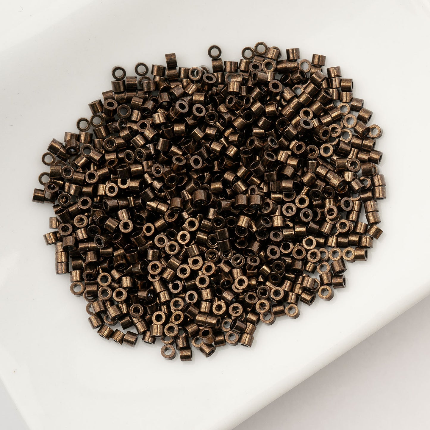 CYLIN BEAD 11/0 25G BAG BRONZE METALLIC