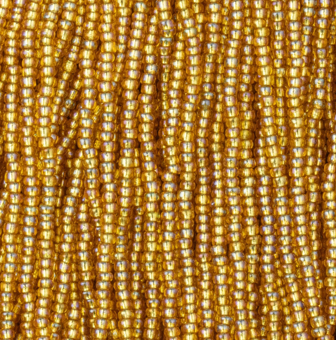 Czech Seed Beads, 11/0 – Silverlined Rainbow Dark Gold (topaz) (strung)