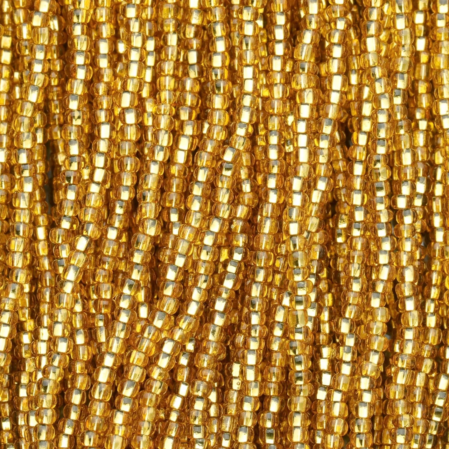 Czech Seed Beads, 11/0 – Silverlined Dark Gold (topaz) (strung)