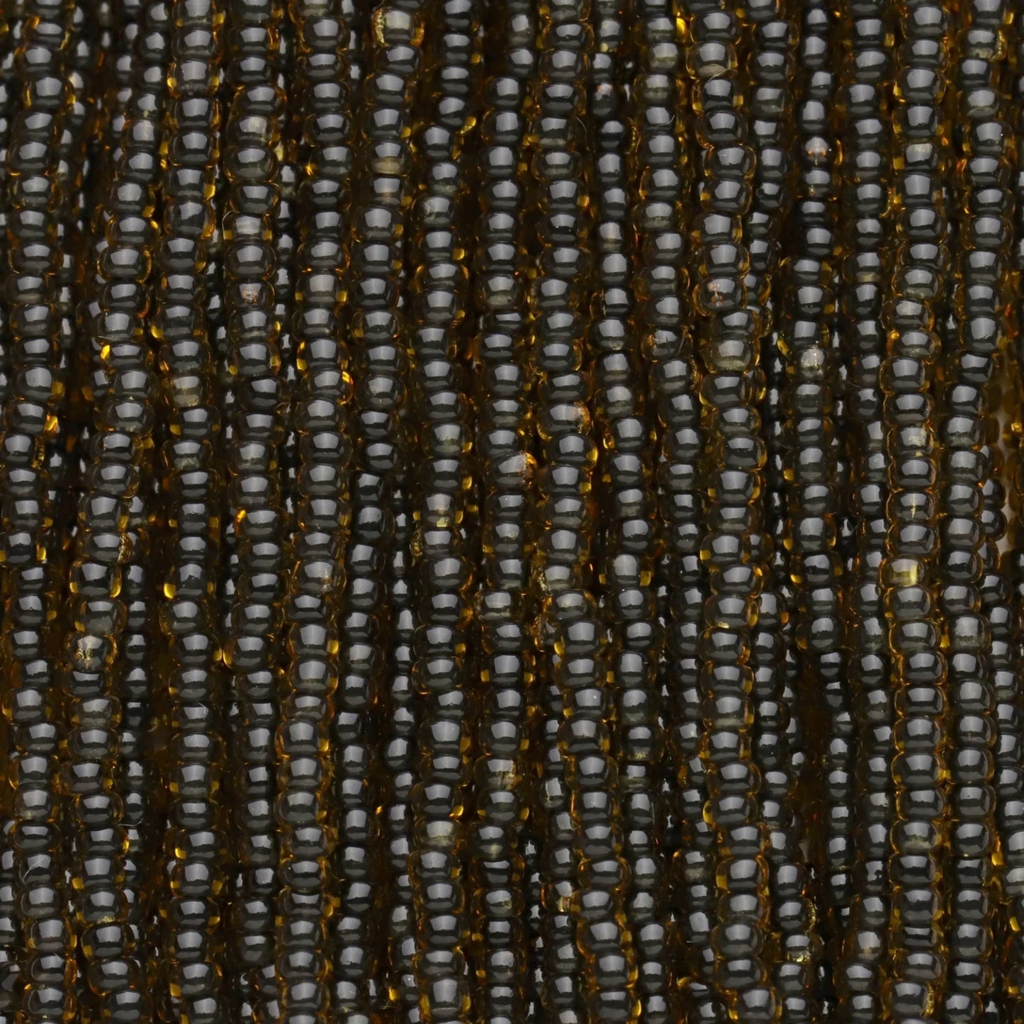 Czech Seed Beads, 11/0 – Colourlined Topaz Jet Lined (strung)