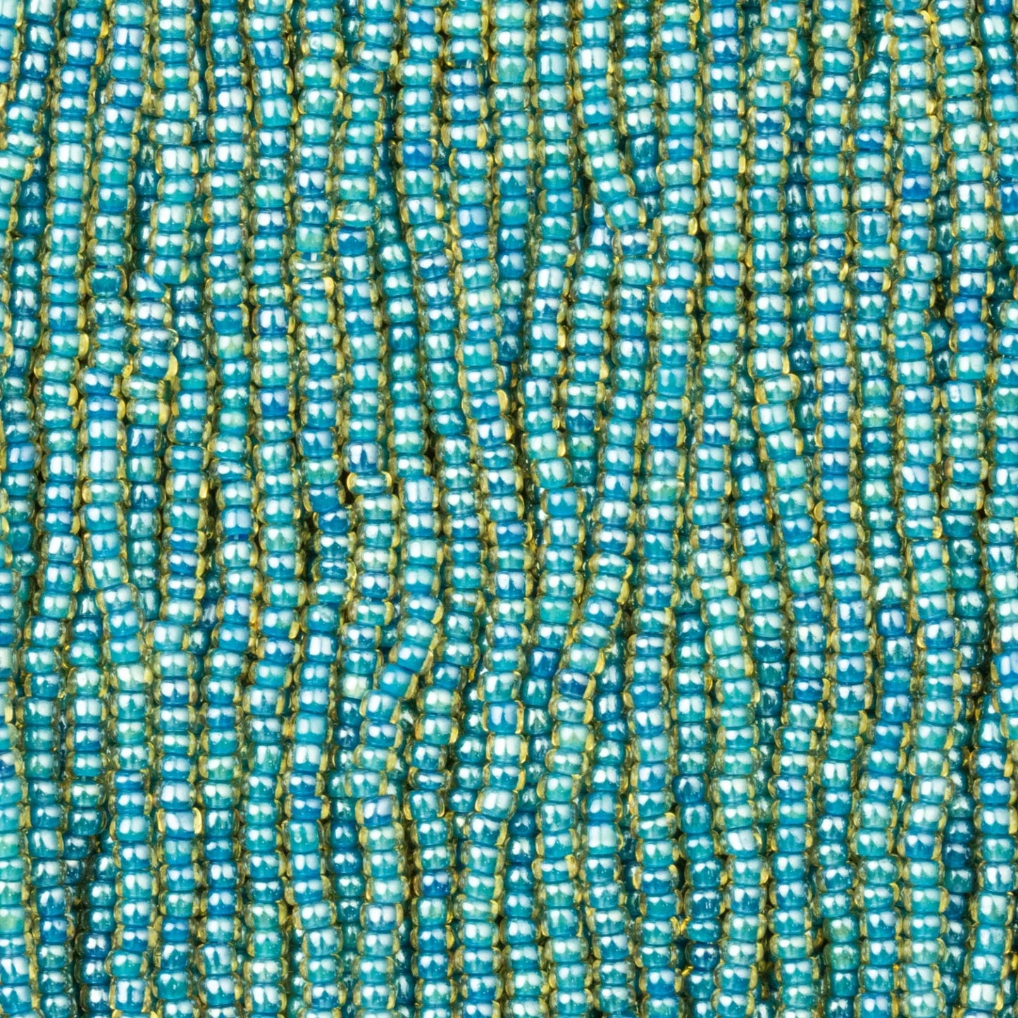 Czech Seed Beads, 11/0 – Colourlined Topaz Blue Lined (strung)