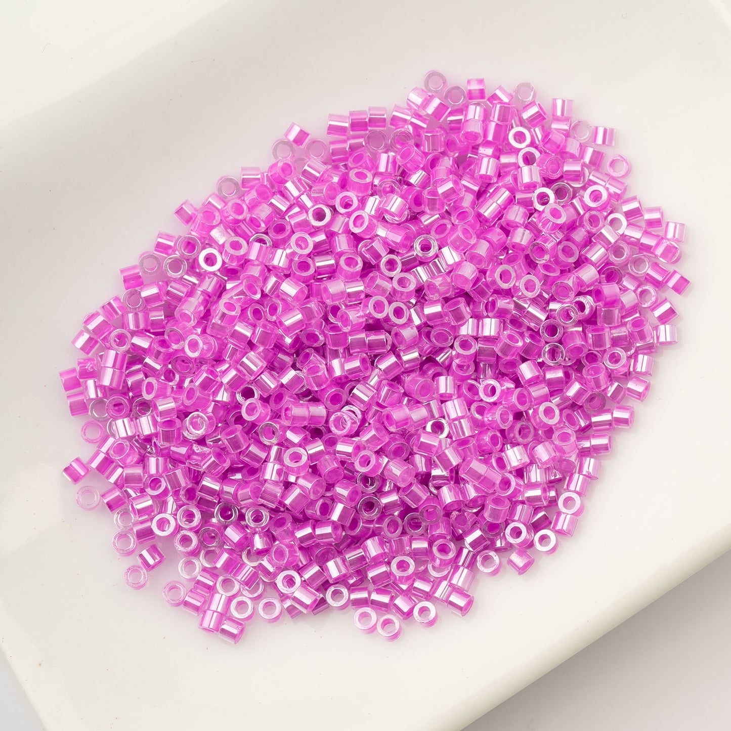 CYLIN BEAD 11/0 25G BAG ORCHID GLOW AB LINED