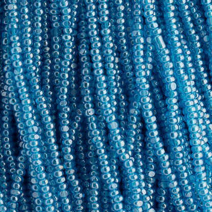 CZECH SEED BEADS 15/0 CUT APX100G TRANSPARENT CAPRI BLUE LUSTER