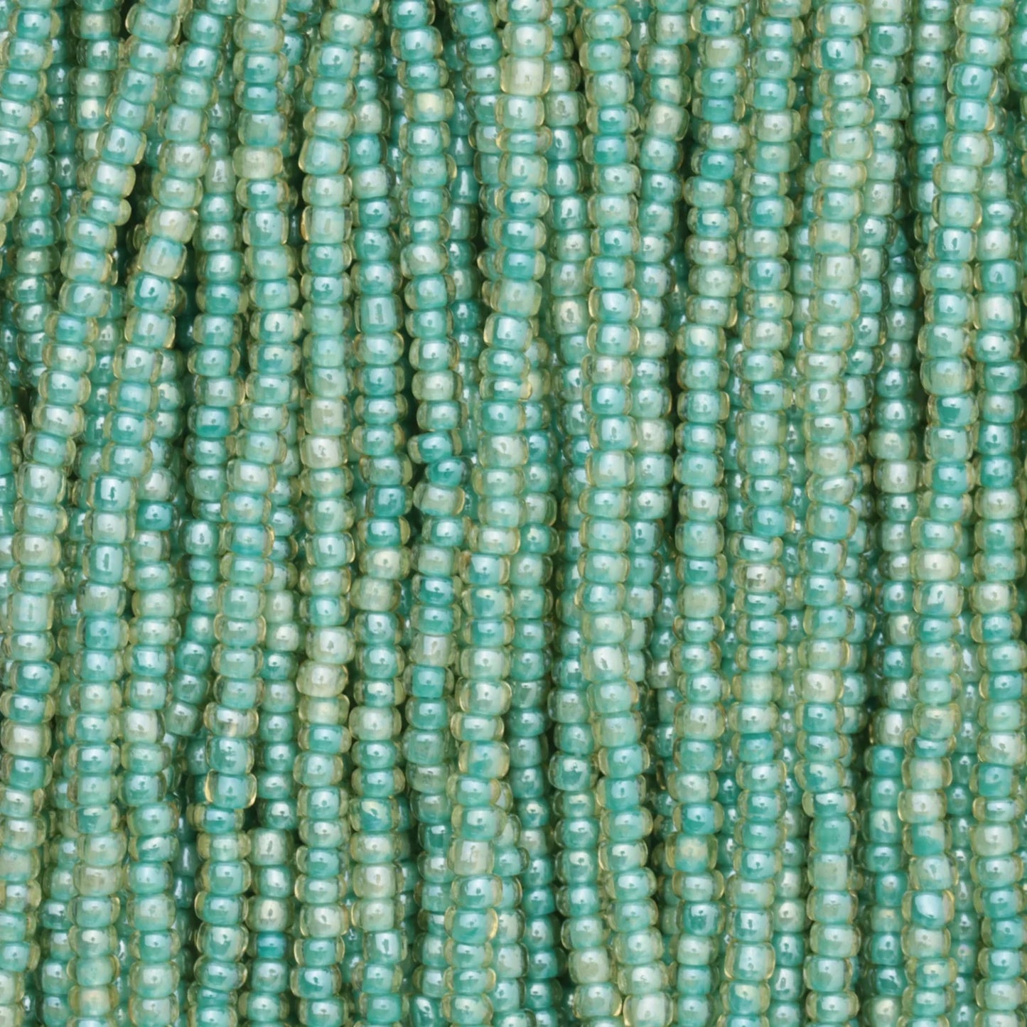 Czech Seed Beads, 11/0 – Colourlined Topaz Green Lined (strung)
